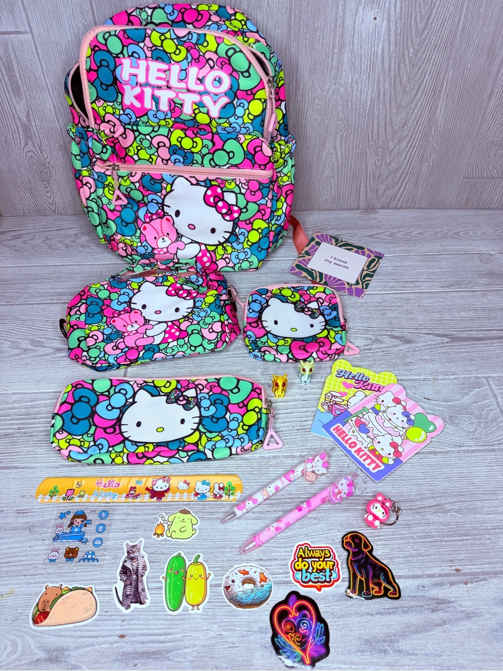 Hello kitty bow backpack bundle stickers, pencil case , dragons , pen , keychain